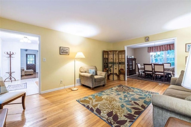 living room with light wood-style floors and baseboards