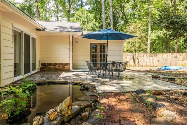 view of patio featuring fence