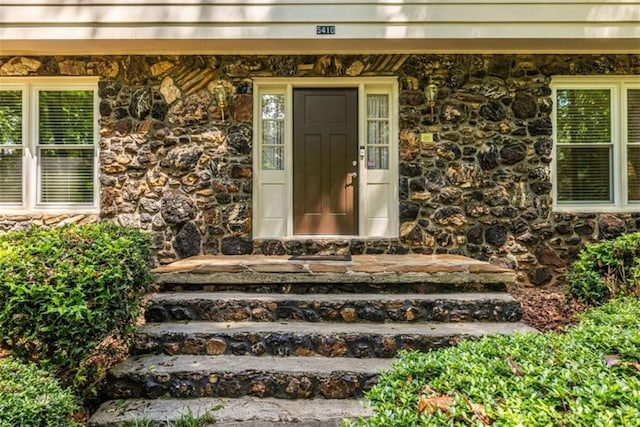 view of exterior entry with stone siding
