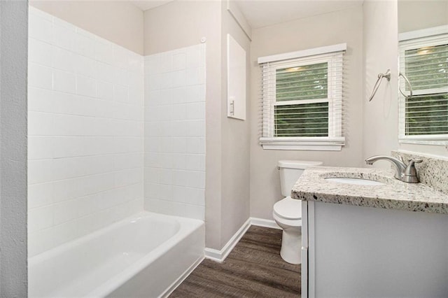 1955 Vicki Ln SE, Atlanta, GA 30316 - full bath with toilet, wood finished floors, vanity, baseboards, and bathing tub / shower combination
