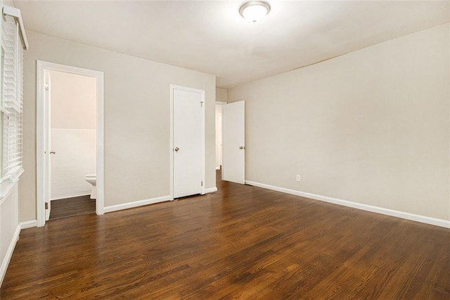 1955 Vicki Ln SE, Atlanta, GA 30316 - unfurnished bedroom with dark wood finished floors, baseboards, and ensuite bath