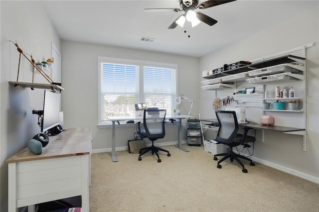 office space featuring ceiling fan, carpet flooring, visible vents, and baseboards