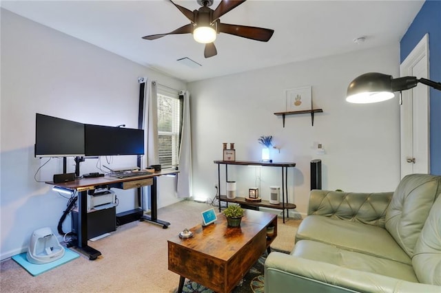 living room featuring carpet floors and a ceiling fan