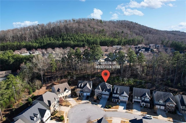 bird's eye view with a forest view and a residential view