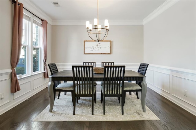 dining space with visible vents, ornamental molding, a chandelier, and dark wood-style flooring