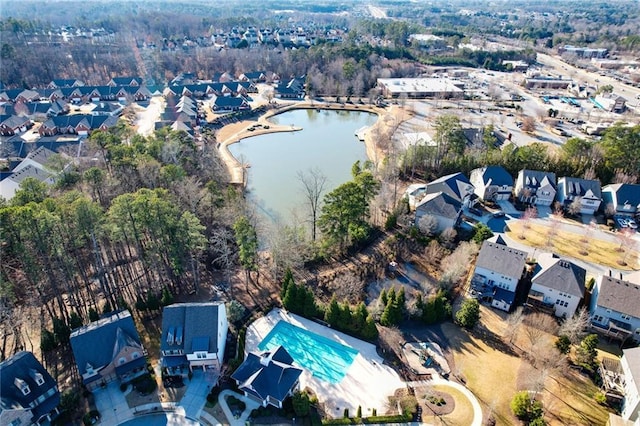 bird's eye view with a water view and a residential view