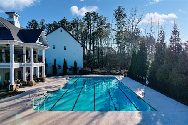 pool featuring ceiling fan and a patio