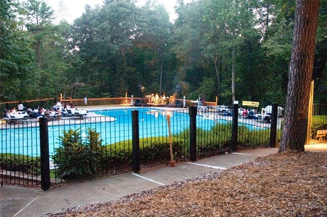 community pool featuring fence