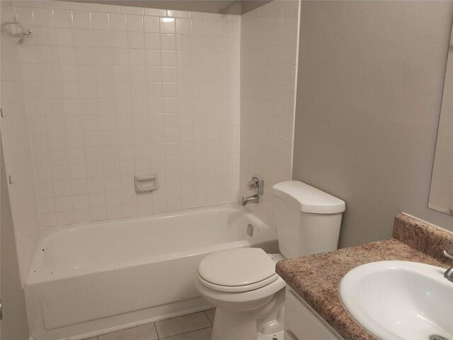 bathroom with tile patterned floors, vanity, toilet, and tub / shower combination