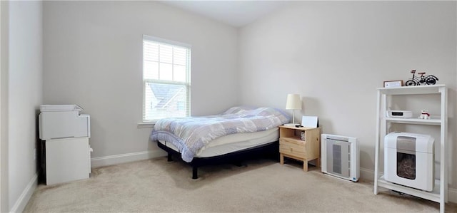 bedroom with light carpet