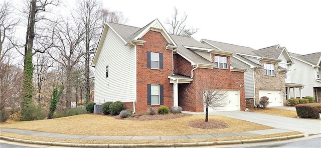 view of front of house featuring central AC unit and a garage