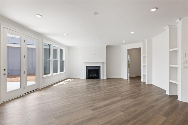 doorway to outside featuring wood finished floors and wood walls