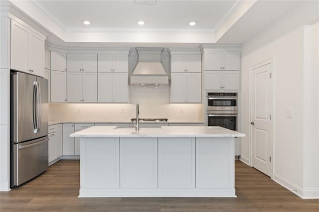 living area with ornamental molding, built in features, baseboards, and wood finished floors
