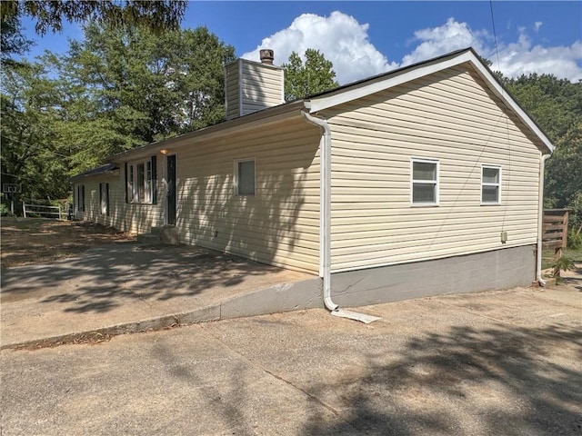 view of side of property with a patio