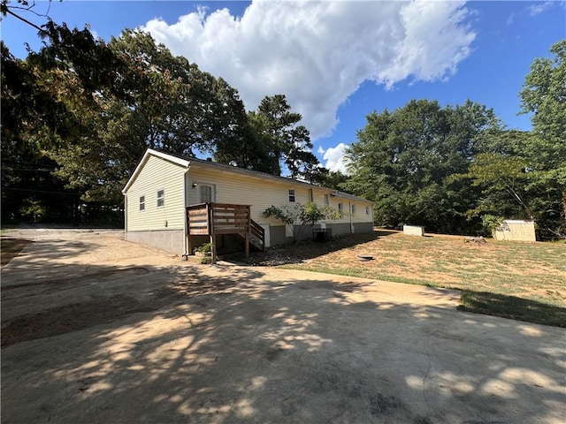 view of front of home featuring a wooden deck