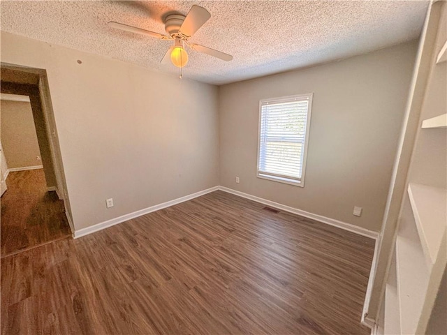 unfurnished bedroom featuring ceiling fan, dark hardwood / wood-style floors, and a textured ceiling