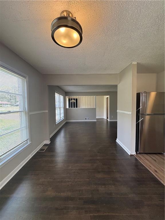 2830 Norgate Ln, Decatur, GA 30034 - interior space featuring baseboards, dark wood-style flooring, and a textured ceiling