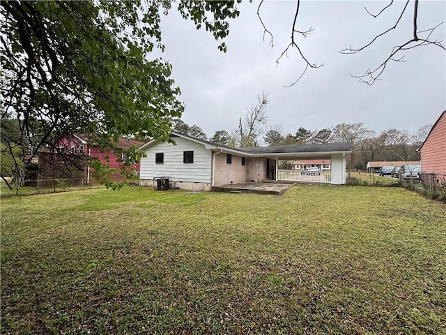 2830 Norgate Ln, Decatur, GA 30034 - rear view of property with central air condition unit, a lawn, and fence