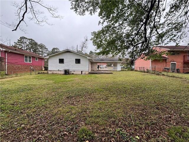 2830 Norgate Ln, Decatur, GA 30034 - back of property featuring cooling unit, fence, and a yard