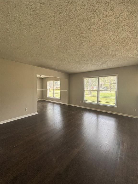 2830 Norgate Ln, Decatur, GA 30034 - spare room with dark wood-type flooring, a textured ceiling, and baseboards