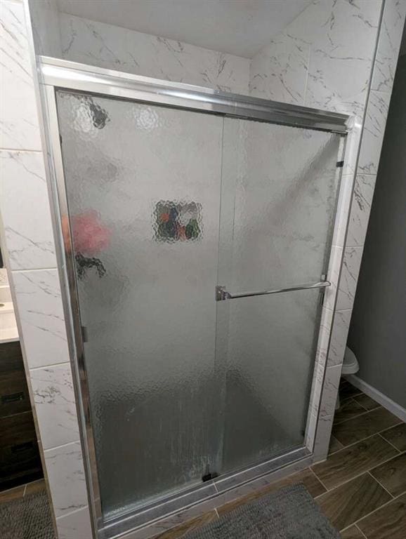 6977 Eunice Dr, Riverdale, GA 30274 - bathroom featuring a shower with door and toilet