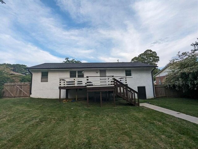 6977 Eunice Dr, Riverdale, GA 30274 - rear view of property with a wooden deck and a lawn