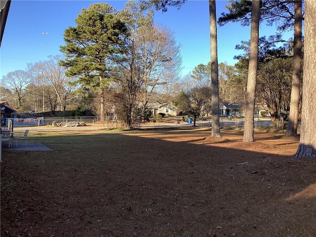 view of property's community with fence