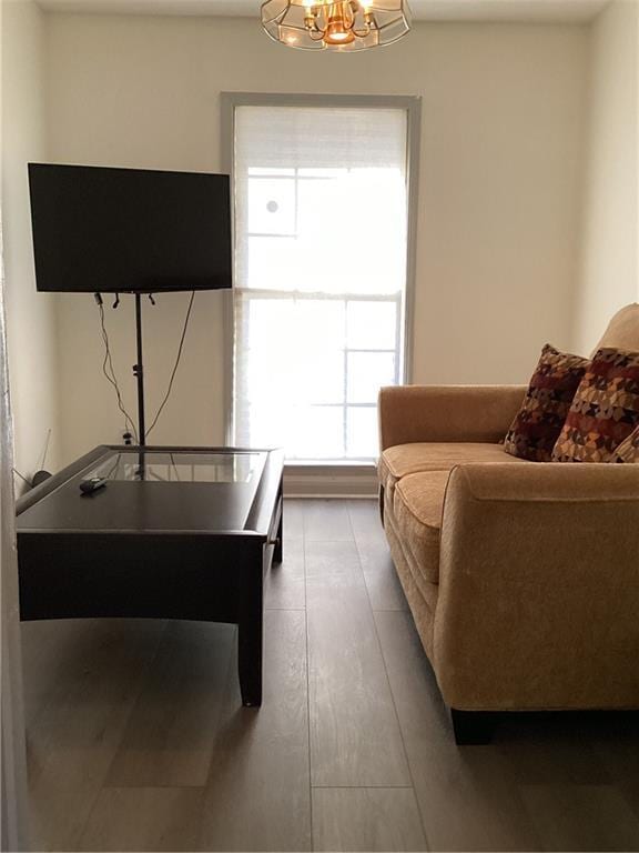 living room featuring a notable chandelier