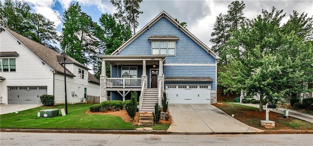 2956 Silver Hill Ter SE, Atlanta, GA 30316 - view of front of property featuring stairs, a garage, concrete driveway, and a porch