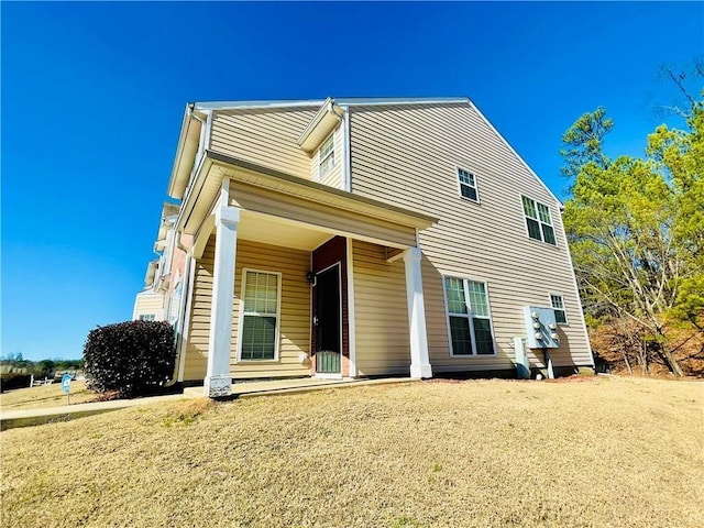 rear view of house with a porch