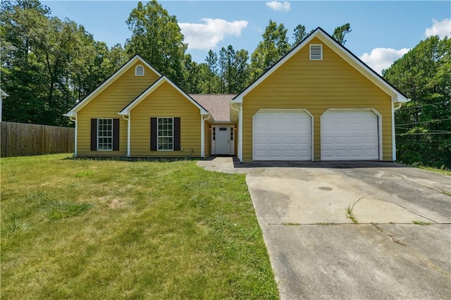 ranch-style house with a garage and a front lawn