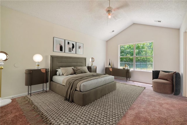 carpeted bedroom with lofted ceiling, ceiling fan, and a textured ceiling