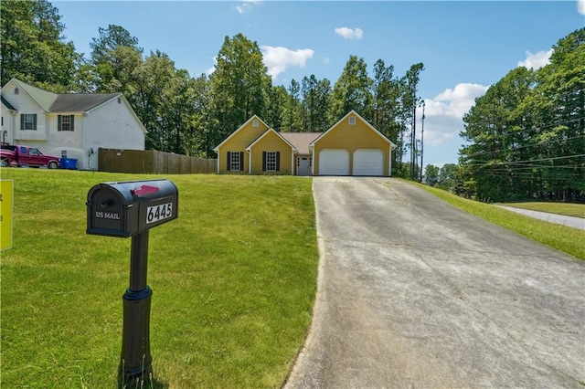 ranch-style home featuring a garage and a front lawn