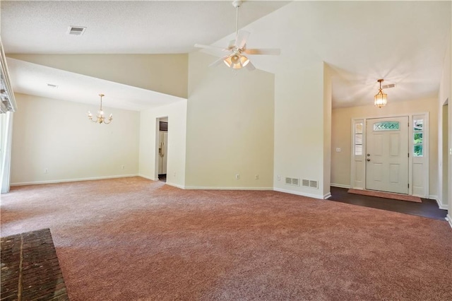 unfurnished living room featuring ceiling fan with notable chandelier, high vaulted ceiling, and dark carpet