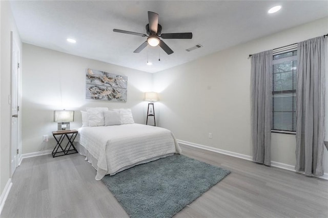 bedroom with hardwood / wood-style flooring and ceiling fan