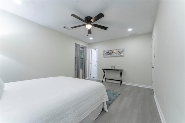 bedroom with ceiling fan and light wood-type flooring