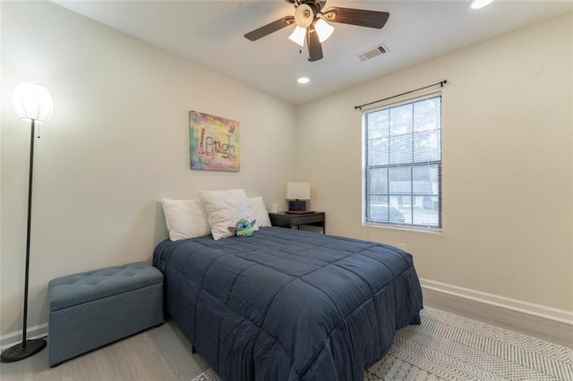 bedroom featuring ceiling fan and light hardwood / wood-style flooring