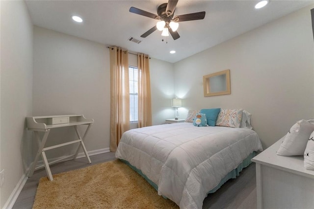 bedroom featuring ceiling fan and dark hardwood / wood-style flooring