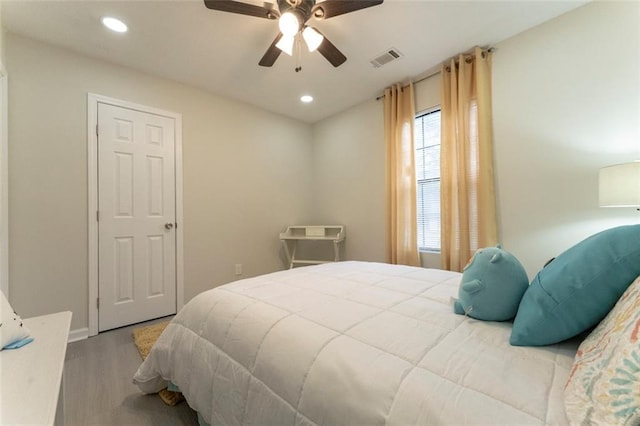 bedroom featuring ceiling fan and wood-type flooring