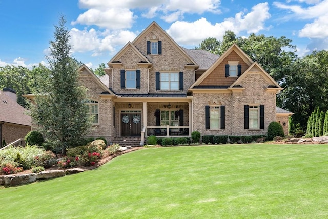 craftsman-style home featuring a front lawn