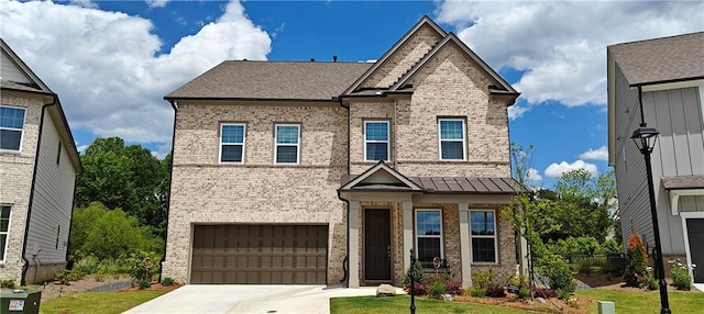 2962 Girard Ln, Duluth, GA 30097 - view of front of property with brick siding, an attached garage, driveway, and a standing seam roof