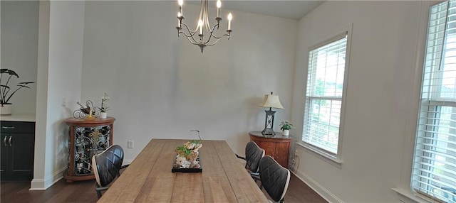 2962 Girard Ln, Duluth, GA 30097 - dining space with a chandelier, wood finished floors, and baseboards