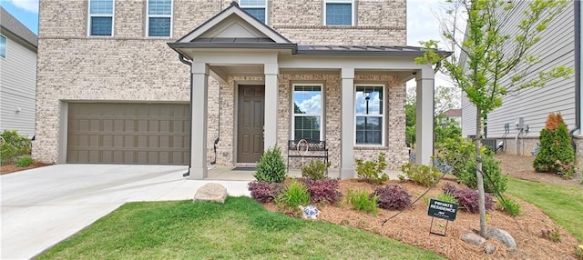 2962 Girard Ln, Duluth, GA 30097 - view of front of house featuring an attached garage, driveway, brick siding, and a standing seam roof