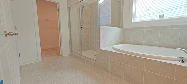 2962 Girard Ln, Duluth, GA 30097 - full bathroom featuring tile patterned floors, a shower stall, a spacious closet, and a garden tub