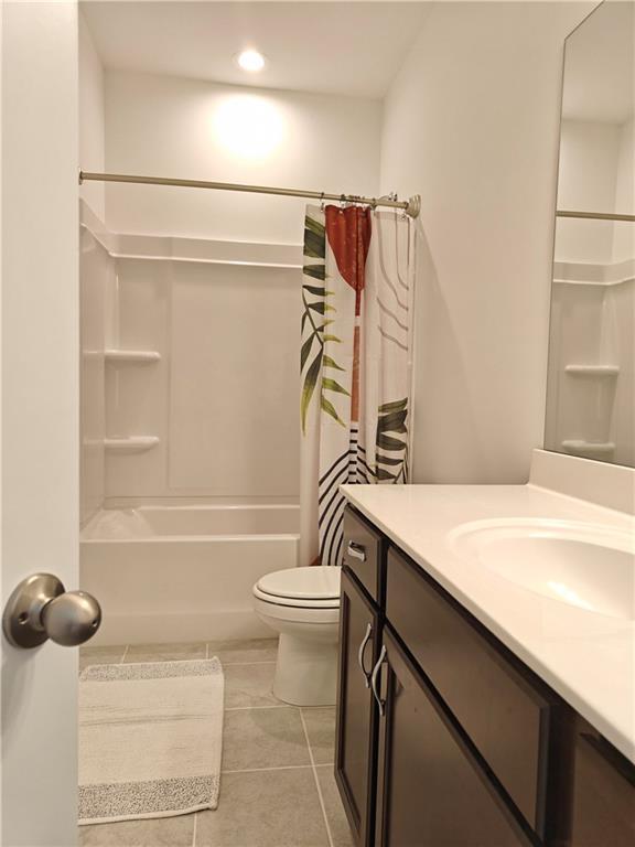 2962 Girard Ln, Duluth, GA 30097 - full bathroom with tile patterned flooring, toilet, vanity, recessed lighting, and shower / bathtub combination with curtain