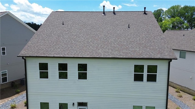2962 Girard Ln, Duluth, GA 30097 - back of house featuring roof with shingles and central AC unit