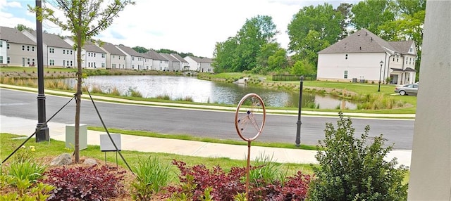 2962 Girard Ln, Duluth, GA 30097 - view of asphalt street with sidewalks, a residential view, and a water view