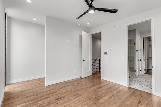 unfurnished bedroom featuring ceiling fan and light hardwood / wood-style flooring