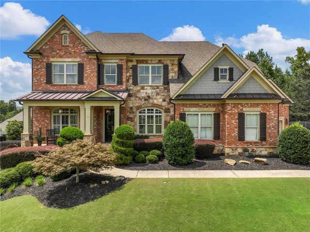 craftsman house with a front lawn