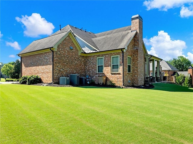 view of home's exterior featuring a lawn and cooling unit